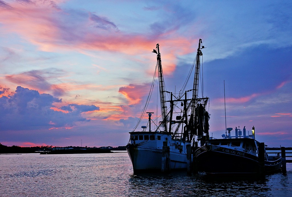 Shrimp boat at sunset by soboy5