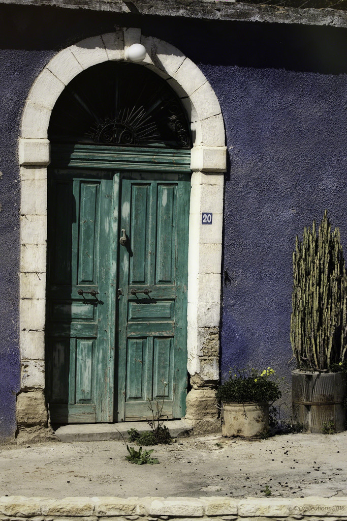 Blue house, green door by evalieutionspics