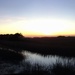 Sunset over salt marsh, panoramic view, Folly Beach, SC by congaree