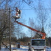 Electrician fixing the street lamp by annelis