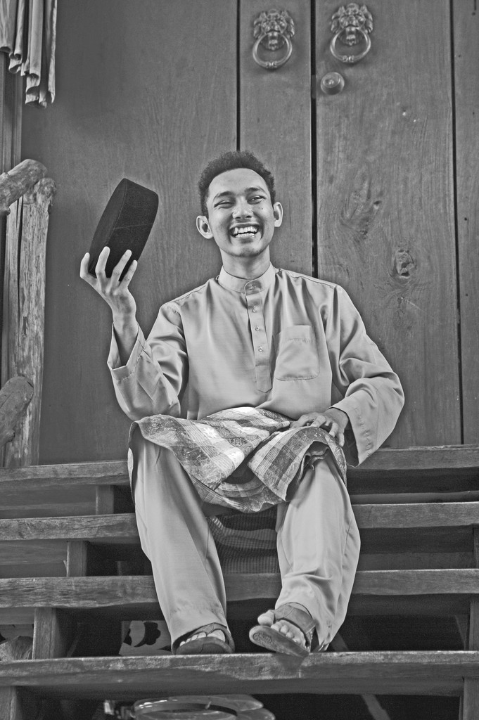 Malay guy in Baju, Sarong and songkok by ianjb21