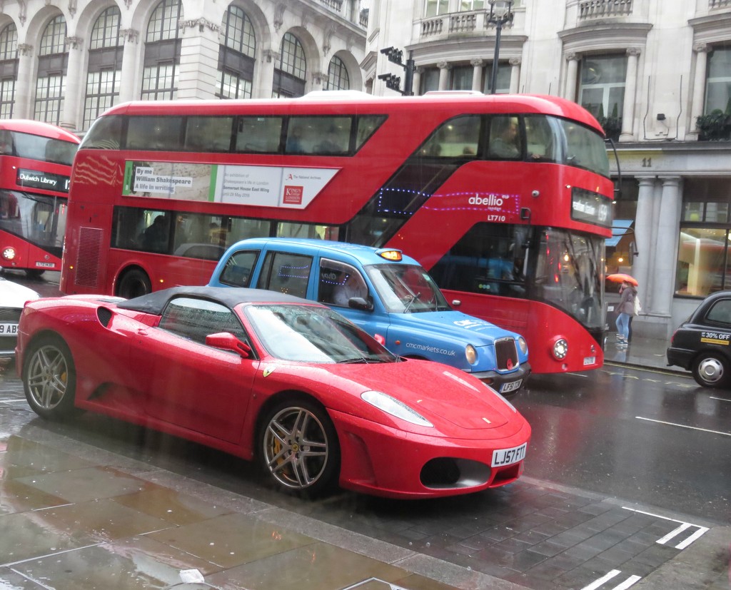 Hmm, Ferrari or bus? by countrylassie