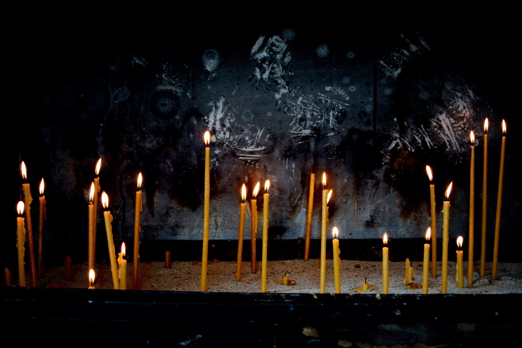 Candles Outside a Church by jyokota