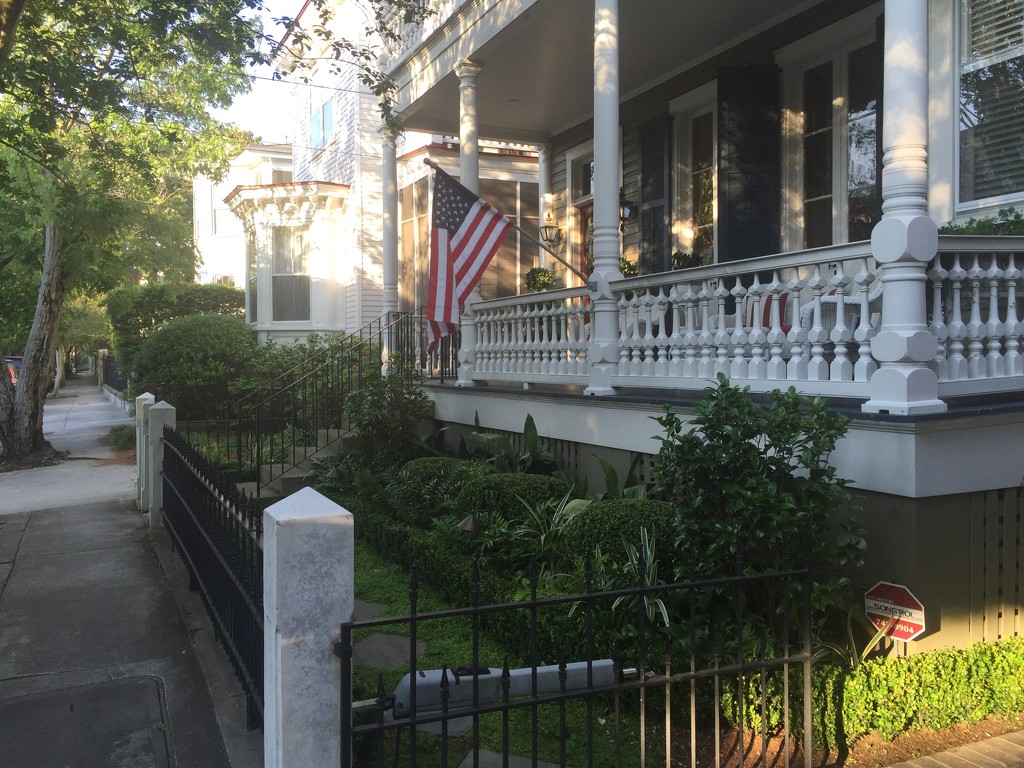 Porch, flag and afternoon light, historic district, Charleston, SC by congaree