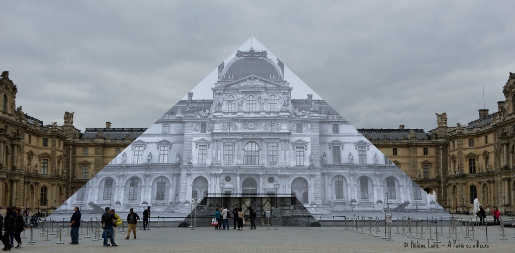 artist JR at the Louvre  by parisouailleurs