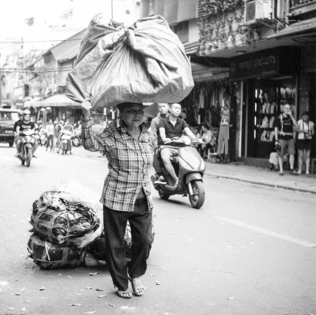 Humans of Vietnam - Balancing act by spanner