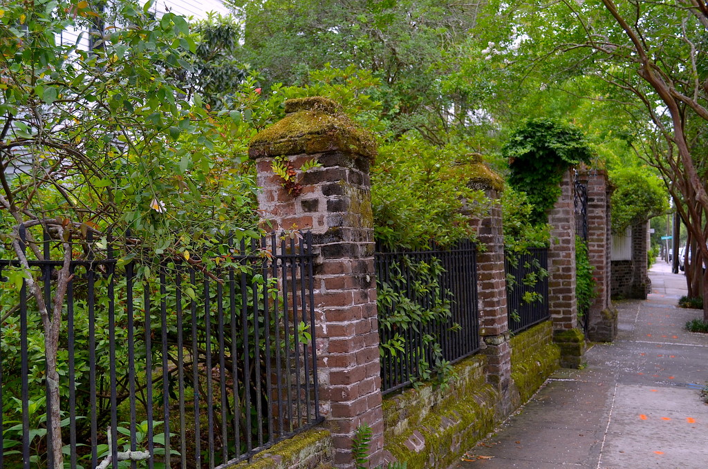 Old brick and iron fence, historic district, Charleston, SC by congaree