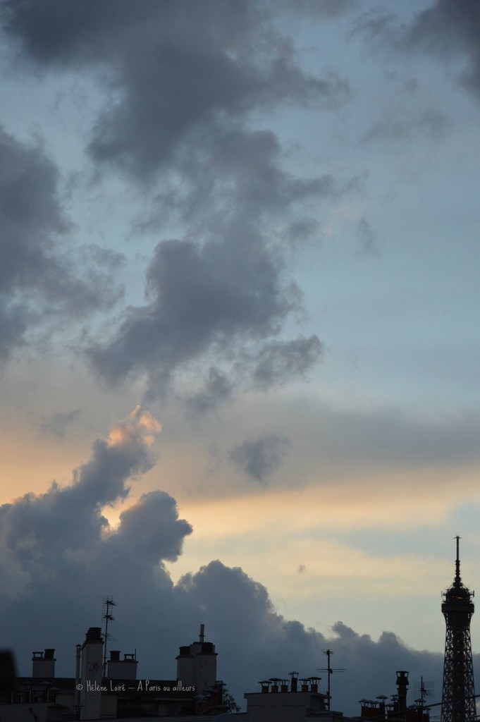 the clouds and the Eiffel Tower by parisouailleurs