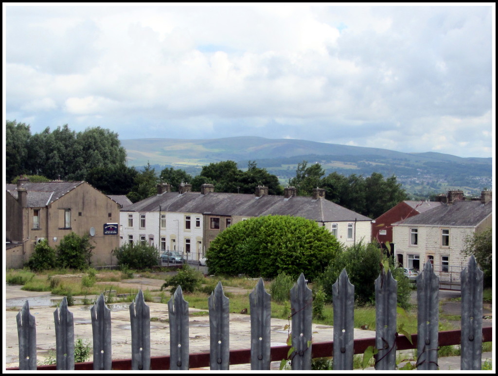 Terraced housing and Pendle Hill. by grace55