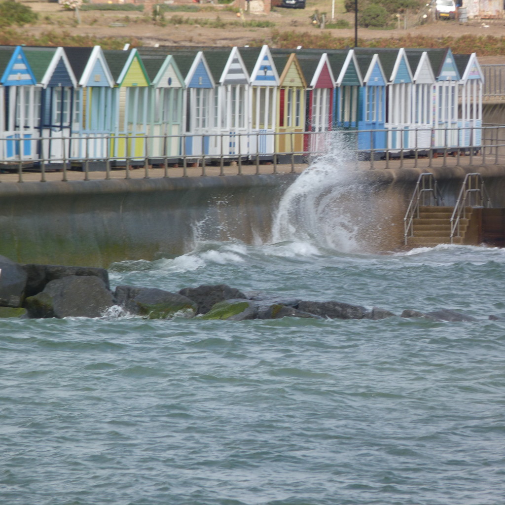 Southwold's huts with wave by 30pics4jackiesdiamond