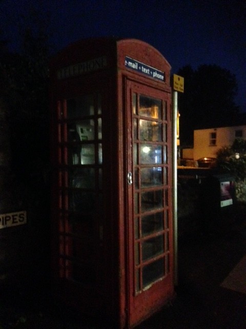 Red phone box in the village by denidouble