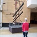 women observing kinetic art sculpture by stillmoments33