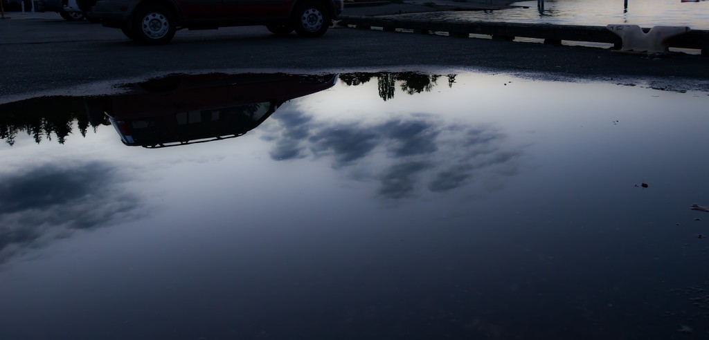 Clouds and puddle by cristinaledesma33
