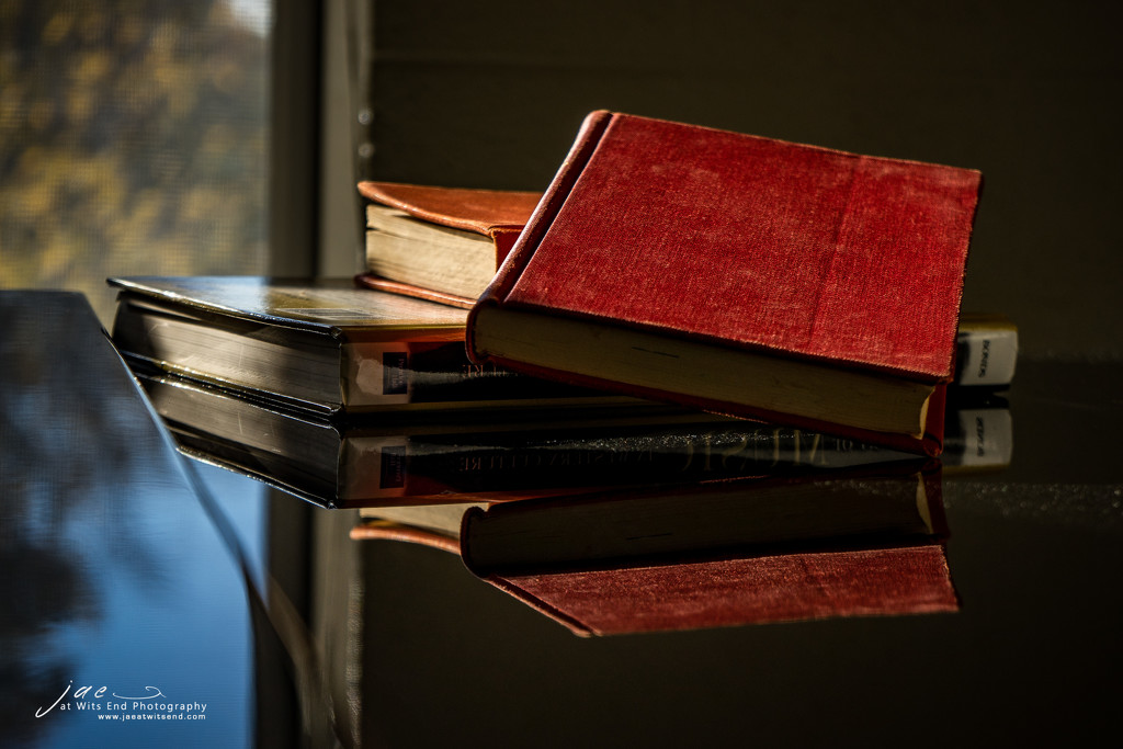 Books Reflected on Piano by jae_at_wits_end