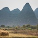 Haystacks Against the Guilin Mountains by jyokota