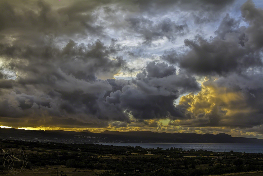 Storm Clouds at Sunset by evalieutionspics