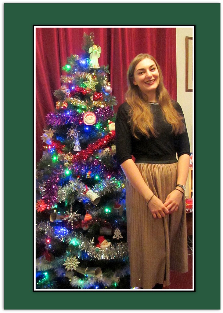 Maria with the Christmas tree she decorated. by grace55