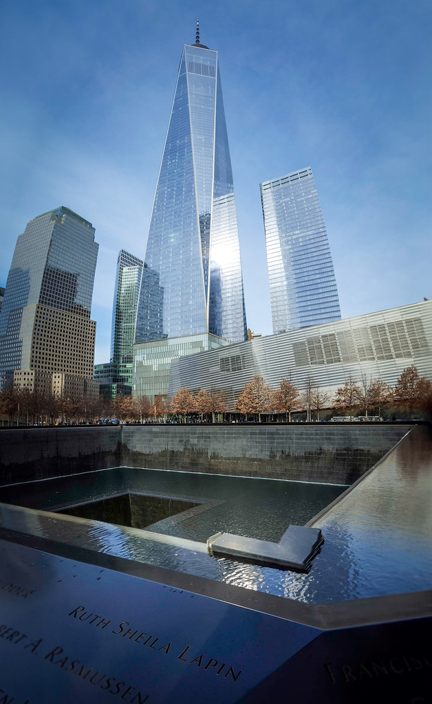 Freedom Tower and 9/11 Memorial Fountains  by darylo