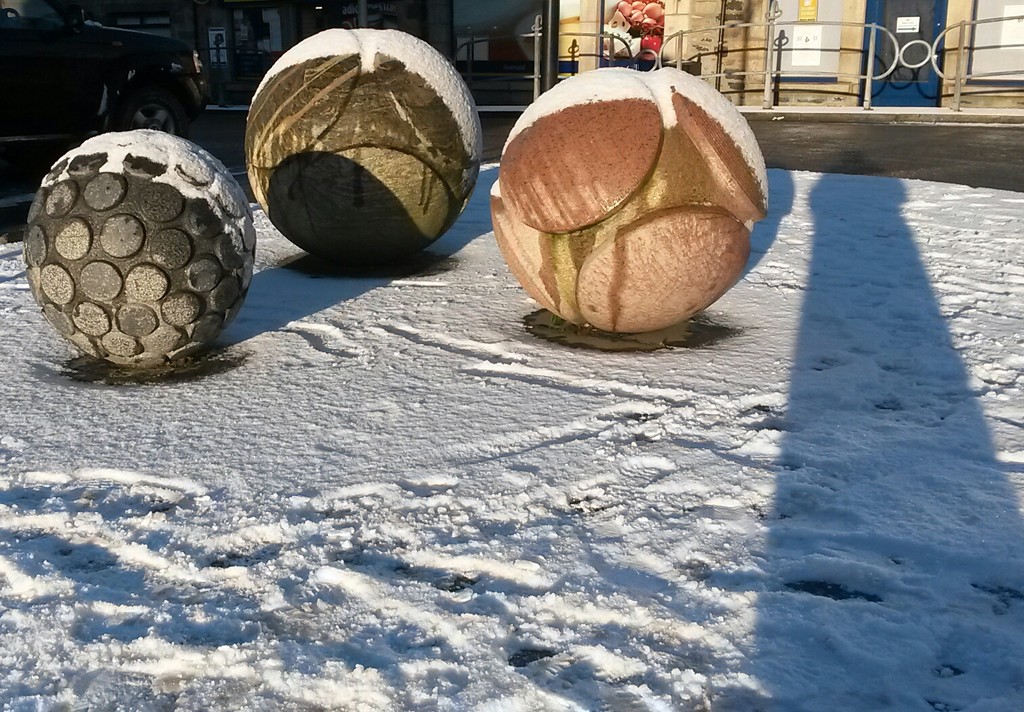 Sunshine, snow and stones in the square  by sarah19
