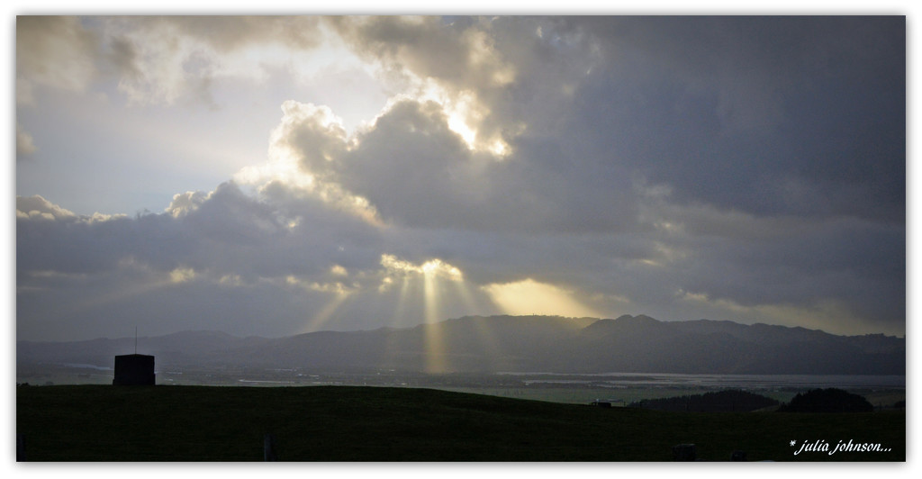 God Beams...Spot light over the river hills.. by julzmaioro