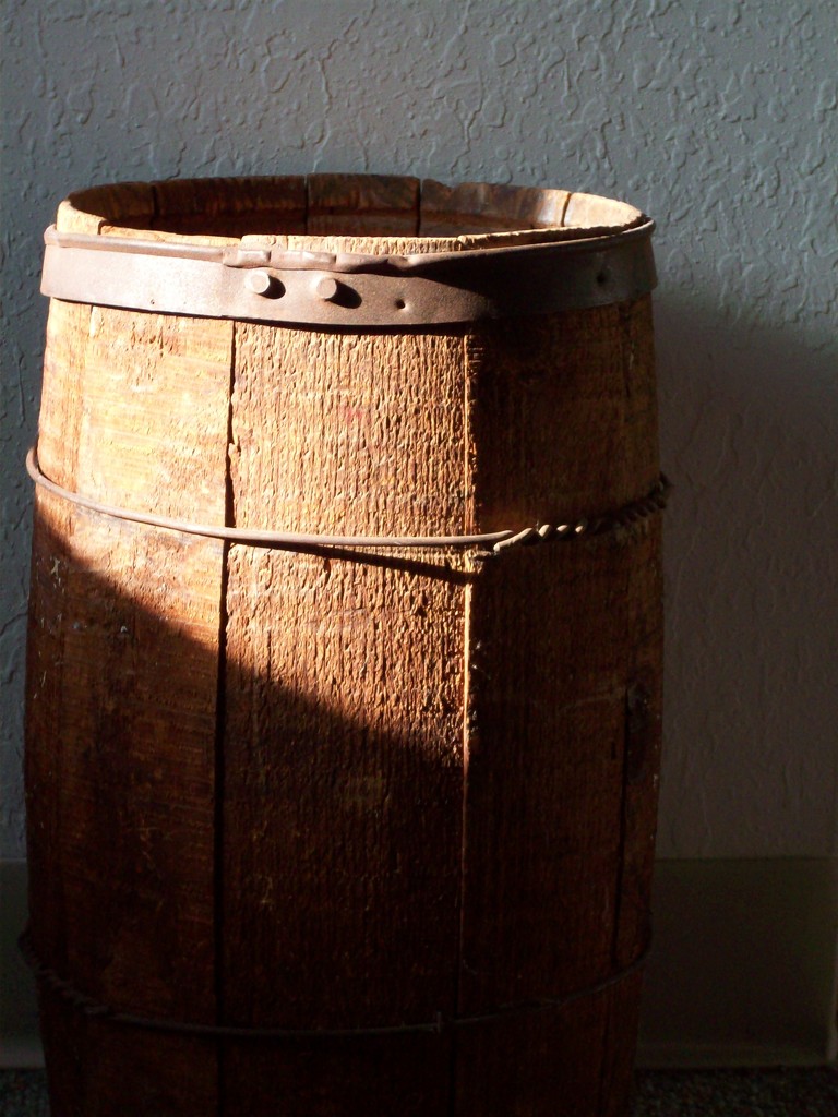 shadow and sun on antique barrel by stillmoments33