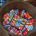 Central piece of stained glass at St Albans by padlock