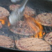 Burgers on Grill Fire Burning by sfeldphotos