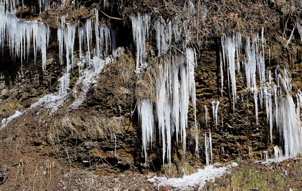 Icicles on a cliff by mittens