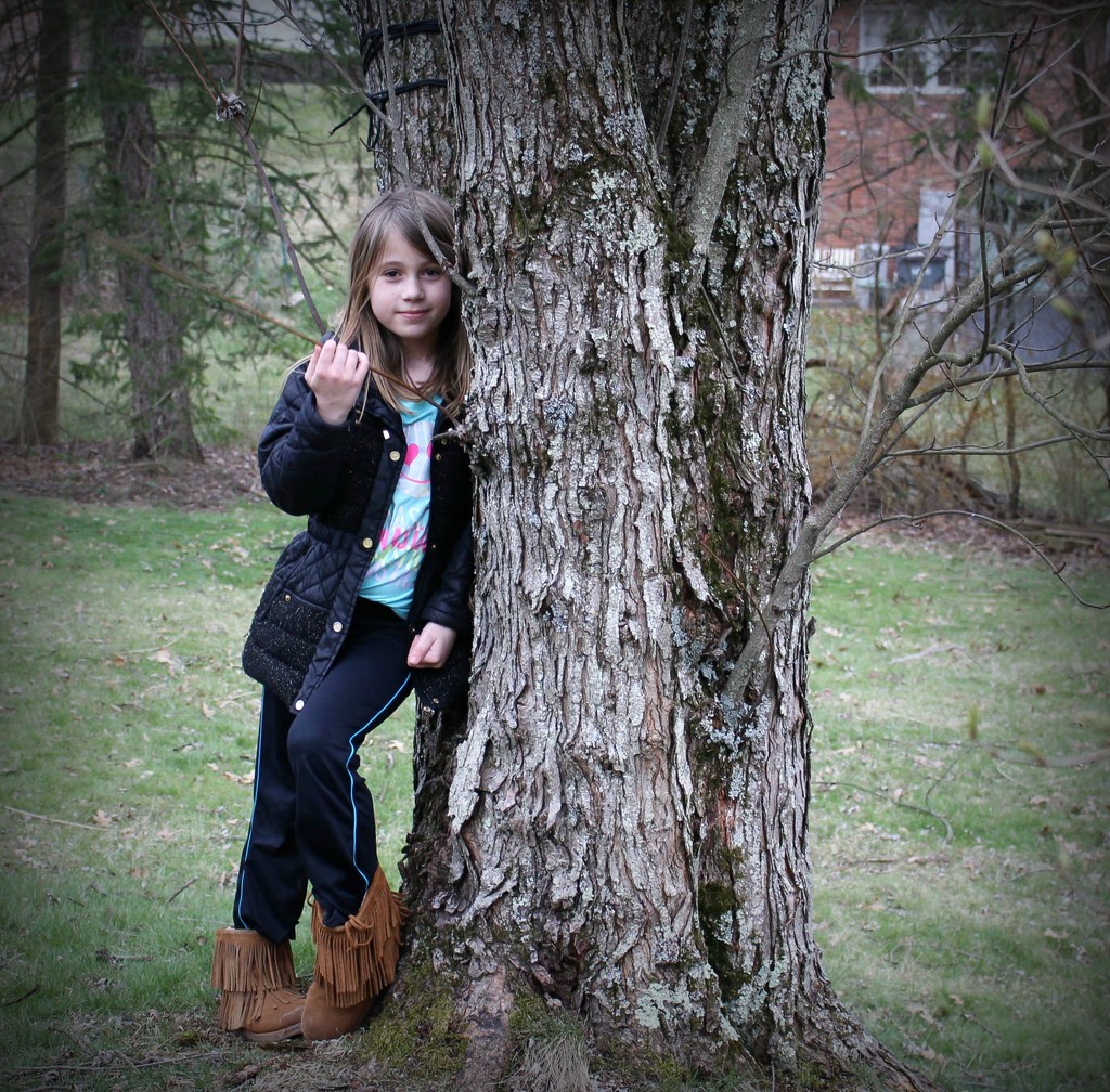 My granddaughter and the tree by mittens