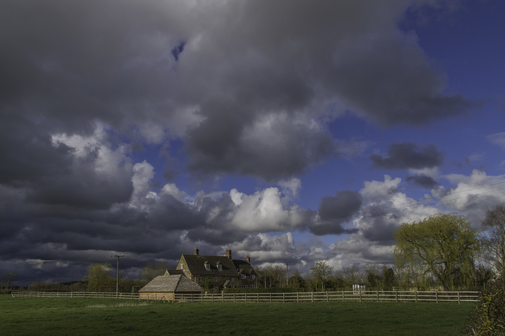 Farmhouse across fields by jon_lip