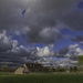 Farmhouse across fields by jon_lip