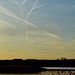 Contrails over Studmarsh Nature Reserve by redandwhite