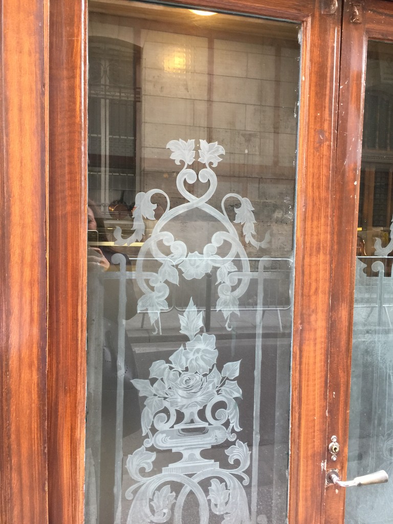 On a Parisian bistrot door.  by cocobella