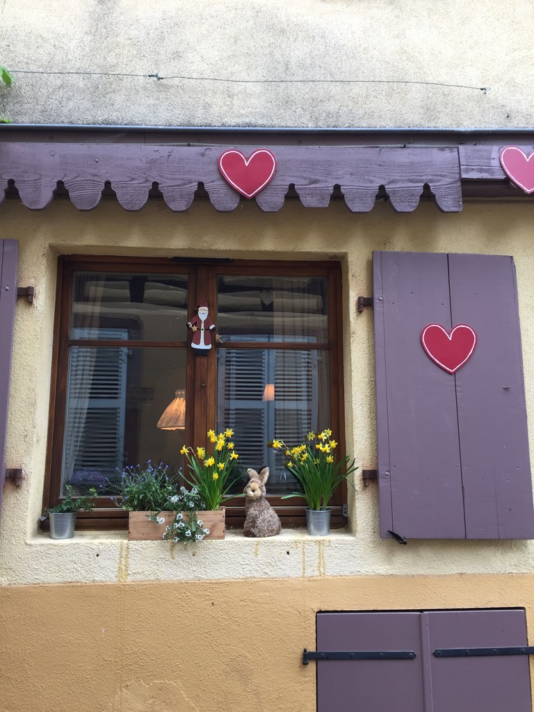 Red heart and brown shutter.  by cocobella