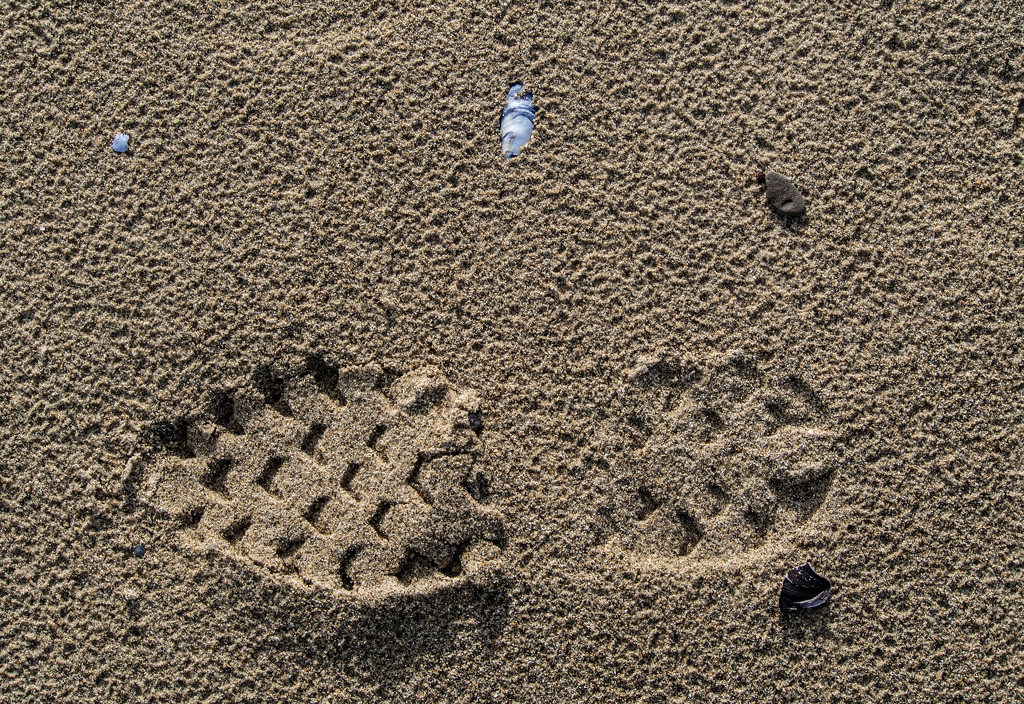 Shoe print in the sand by frequentframes