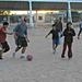 Soccer with a Basketball on a Field of Dirt by alophoto