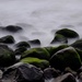 Rocks in the surf by dkbarnett