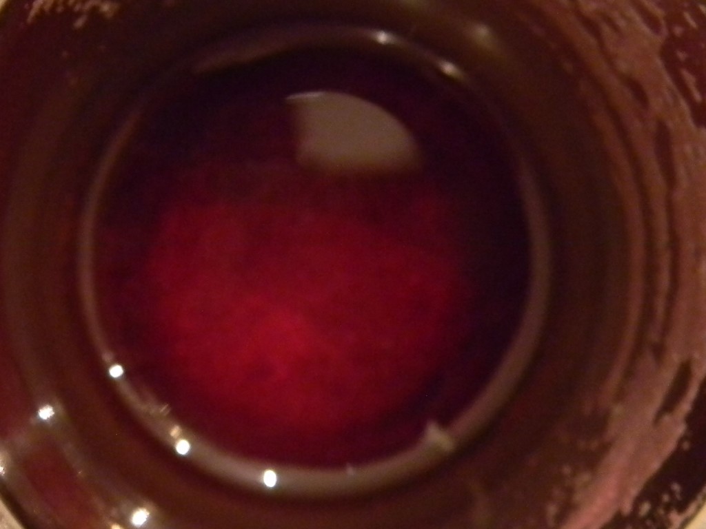 Closeup of Grape Juice in Cup by sfeldphotos
