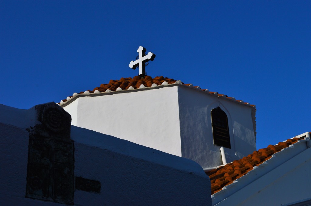 Church in Lindos under a blue sky by caterina