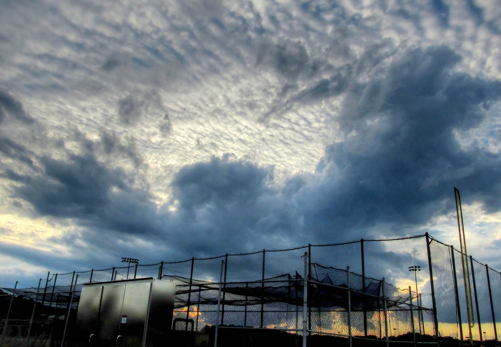Sky through the batting cage by mittens