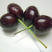 Two double cherries in a handful by bruni