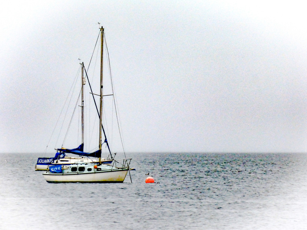 Two yachts in the rain by frequentframes
