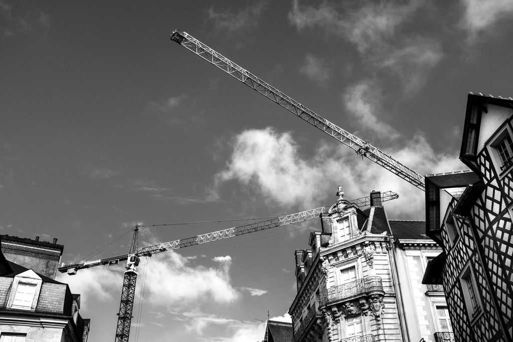 Cranes towering over the old quarter of Rennes by vignouse