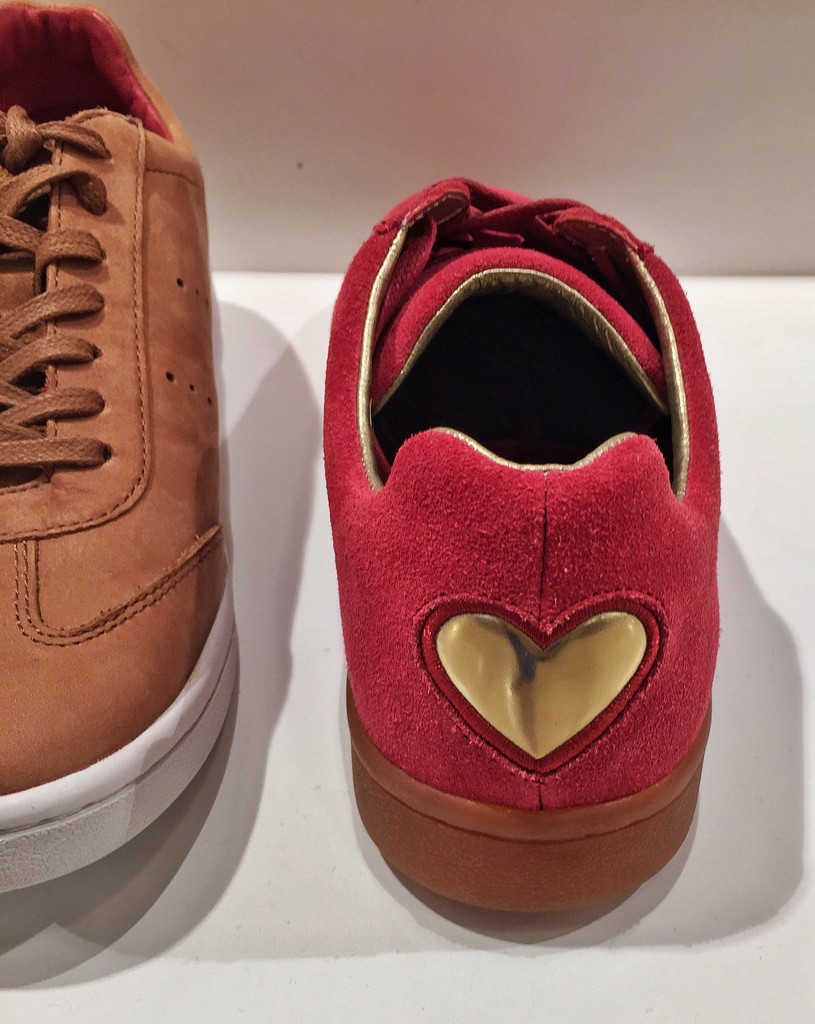 Golden heart on red shoe.  by cocobella
