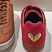 Golden heart on red shoe.  by cocobella