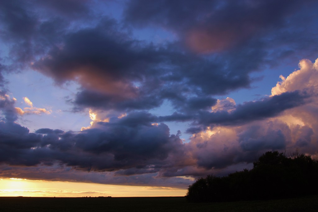 Thick Clouds At Sunset by bjchipman