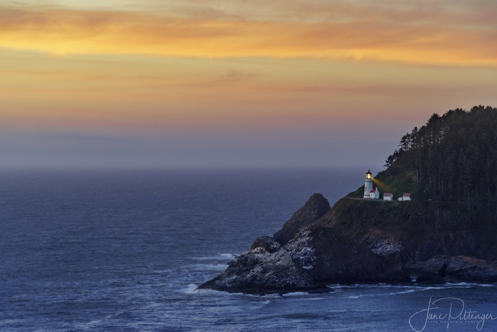 Lighthouse At Sunset by jgpittenger