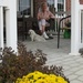 Katie on her porch by tunia