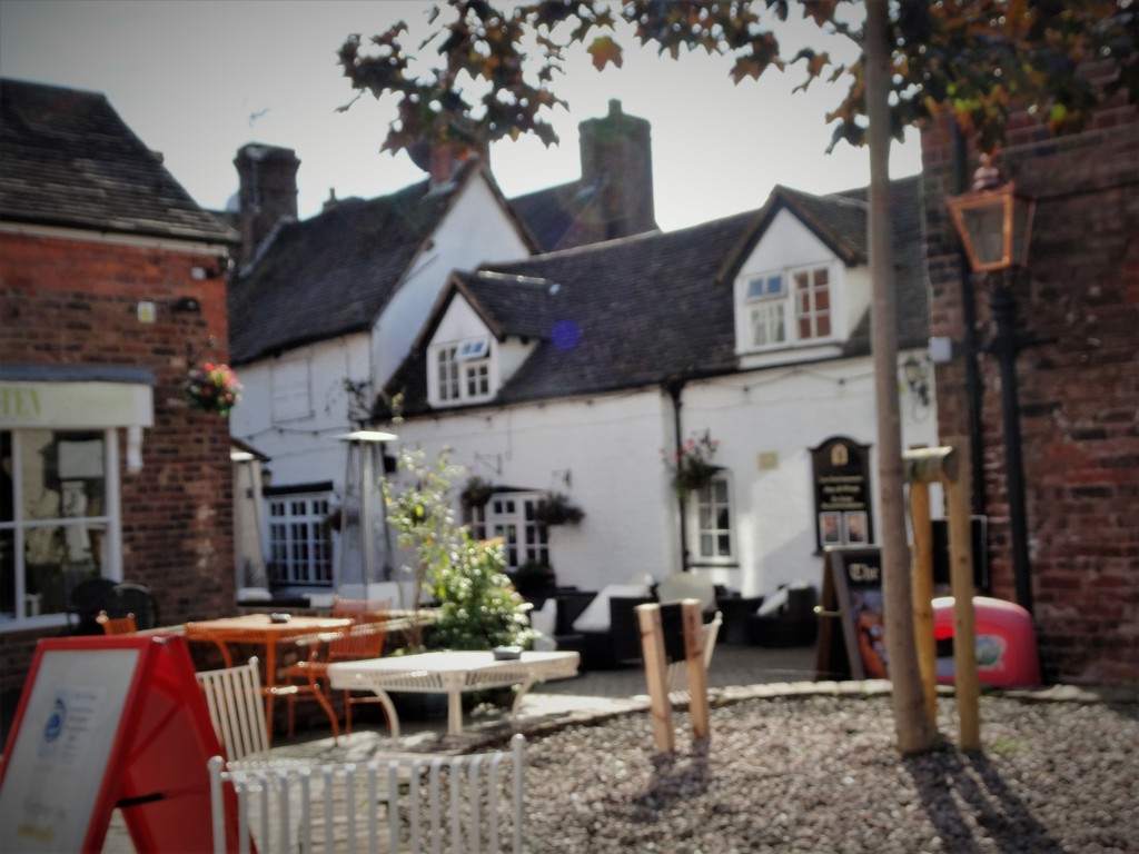 A quaint little pub at the end of the courtyard !  by beryl
