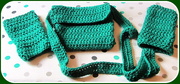 15th Oct 2017 - A crocheted green acrylic bag and a pair of handwarmers.